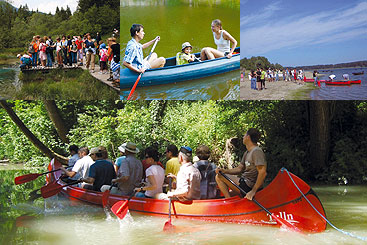 a group of people riding on the back of a boat