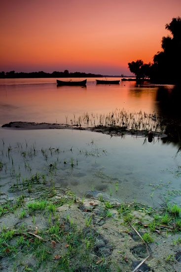 a sunset over a body of water