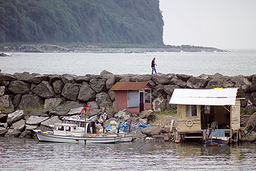 a group of people in a boat on a body of water