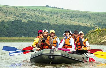 a group of people riding on the back of a boat