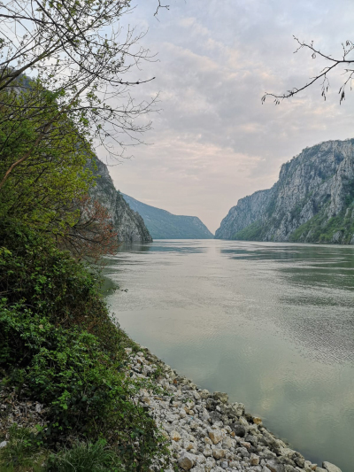 a body of water with a mountain in the background