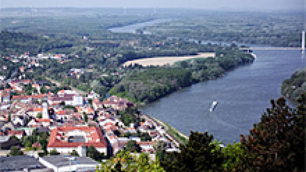 A view of a large body of water with a city in the background