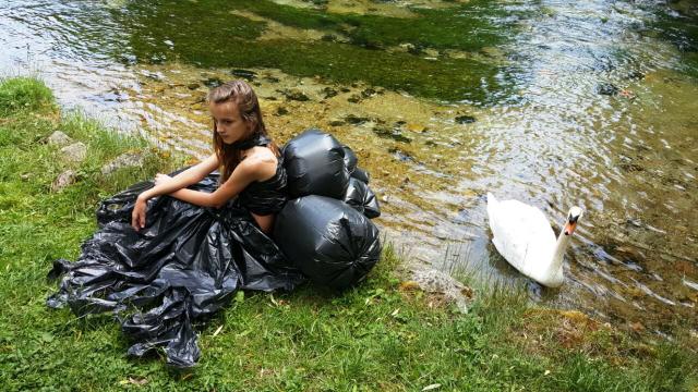 a person sitting on a motorcycle in the water