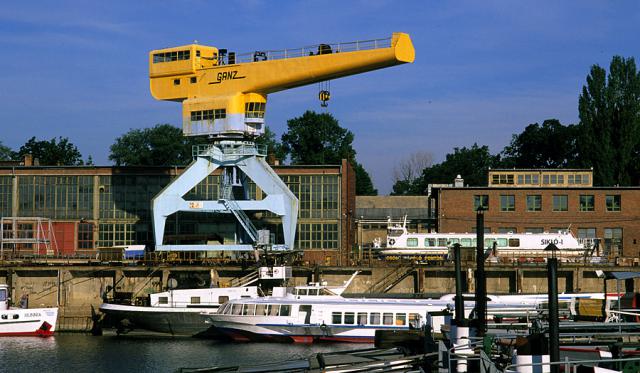 a boat is docked next to a body of water