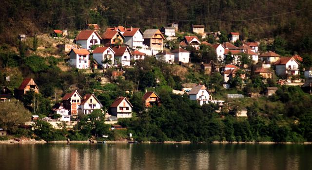 small houses next to a body of water