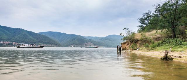 a group of people in a boat on a body of water