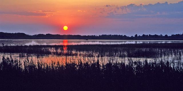 a sunset over a body of water