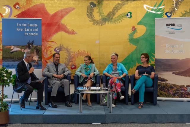 a group of people sitting on a bench posing for the camera