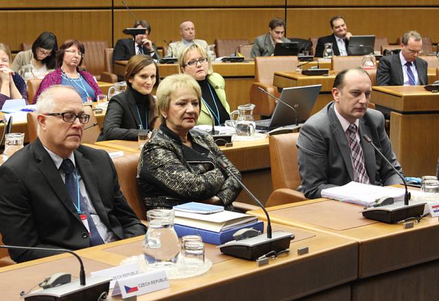 a group of people sitting at a desk