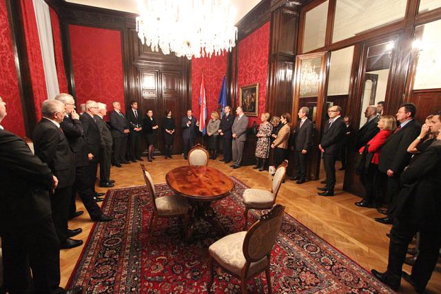 a group of people sitting at a table in a room