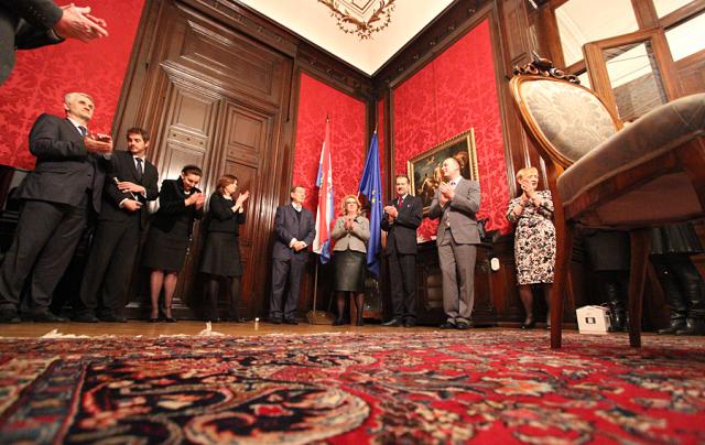 a group of people standing on a rug